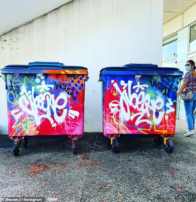 Two large outdoor trash bins used as a canvas by street and graffiti artist Julien Blanc, on display