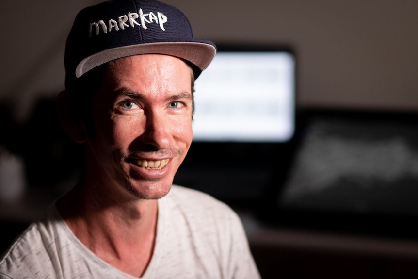 Mulka Centre project manager Joseph Brady, sitting down and smiling at the camera. 