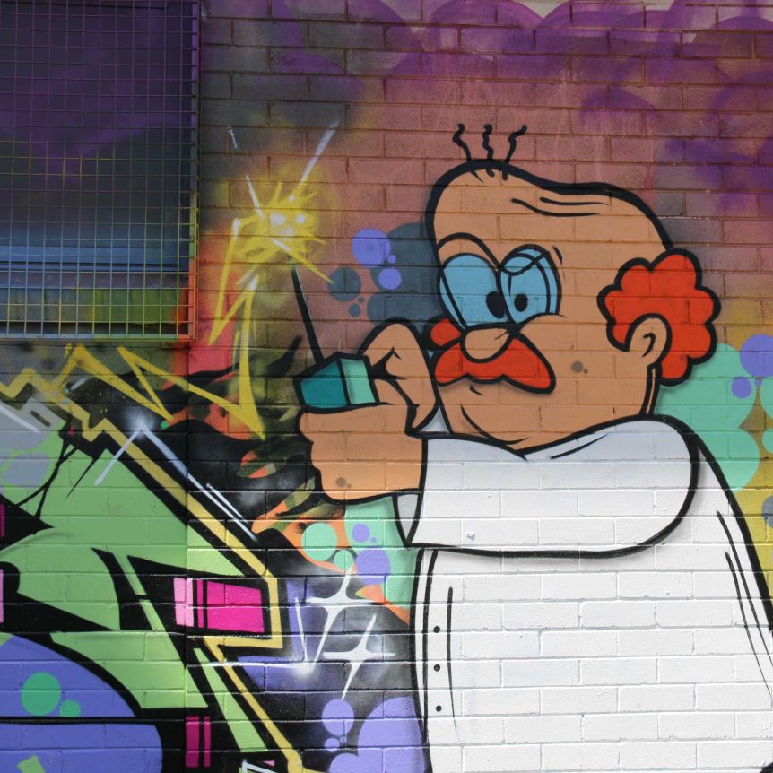 The mural features a little bald man with a phone.