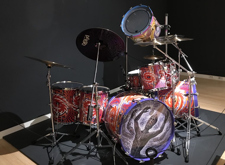 Alex Grey, Hand-Painted Drum Kit, acrylic on wood, 2019. On view at MCAM, courtesy of Danny Carey and Tool. - LYNN TRIMBLE