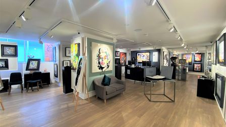 The modern open-plan unit at 13 Back of the Inns has wooden floors with a small staff area and storeroom at the rear