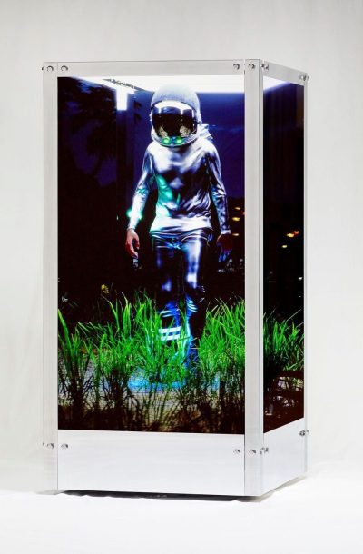 beeple's sculpture displaying an astronaut walking through grass