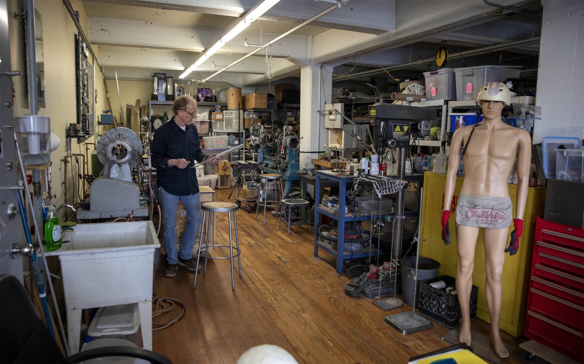 Artist Wayne Strattman at his glass and plasma studio in Boston. (Robin Lubbock/WBUR)
